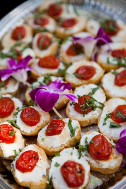 mini bruschettas with fresh herbs and tomatoes are amazing for spring or fall wedding appetizers