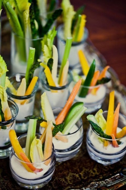 fresh veggie slices in cups with dip are adorable for a spring wedding, they are light and healthy