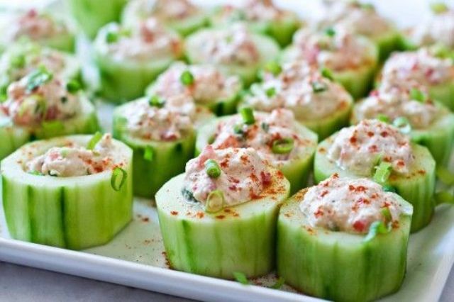 fresh cucumbers with crab meat in sauce and herbs is a tasty and delicious wedding appetizer