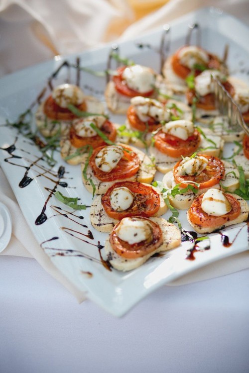 mini bruschettas with tomatoes and mozzarella chese plus herbs and balsamic are a traditional idea and classics